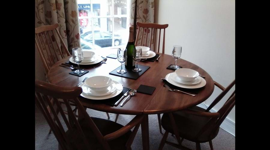 Quality bone china and modern cutlery, enjoy dining with a view of the High Street.