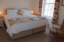 Queen sized Sealy bed in the large front bedroom, can be made into 2 full sized singles