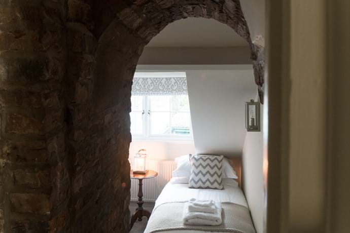Twin bedroom looking through the archway