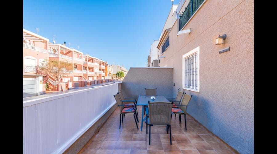 Large patio area with furniture. Perfect for dining and/or relaxing outside