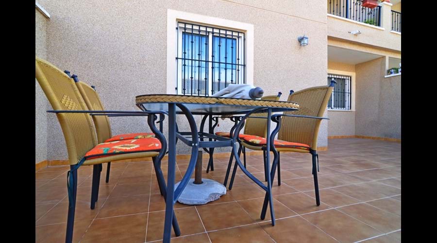 Large patio area with furniture. Perfect for dining and/or relaxing outside