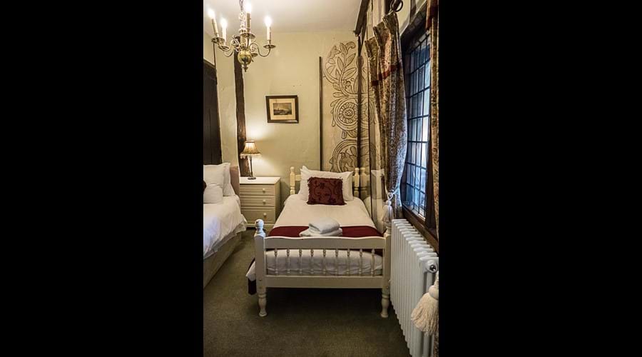 First floor twin bedroom with old wall paintings