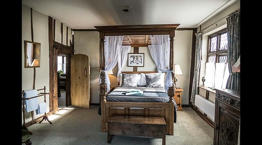 Another view of bedroom with four poster bed