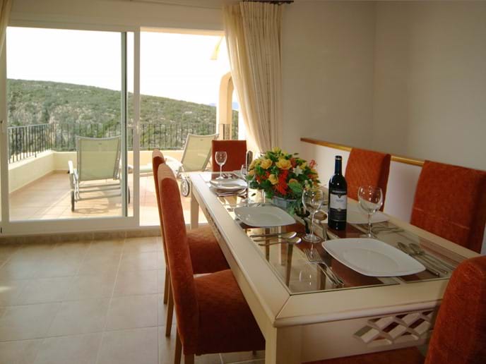 Dining table for 6 with views across the terrace to the sea
