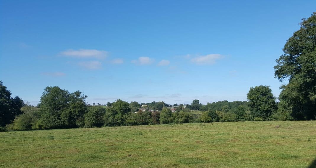 View across farmland to the village of Perigny, Calvados, Normandy