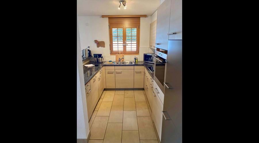 Cooks kitchen with fridge freezer