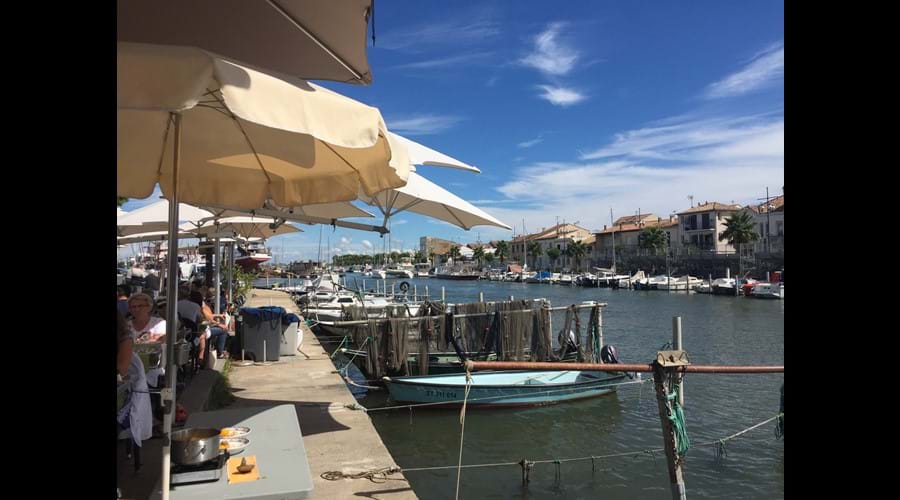 dining next to the small fishing boats