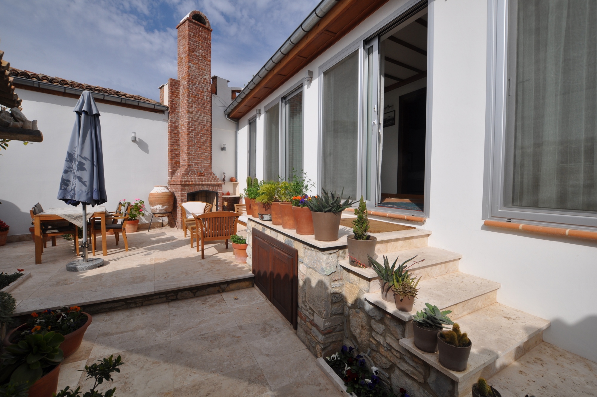 Entrance to Ionia House showing open fireplace