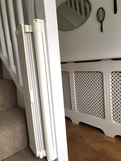 Baby gates at the bottom and top of the stairs