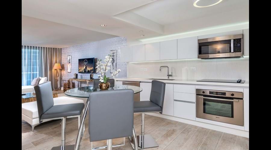 "Lots of space in the full size kitchen high end appliances , large fridge "