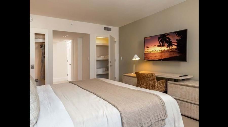 "Beautifully furnished bedroom with smart Samsung tv"