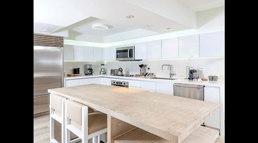 "Lots of space in the full size kitchen high end appliances , large fridge "