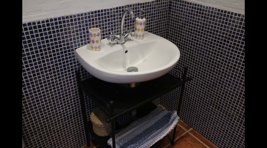 There are two shower rooms each also with basin and toilet