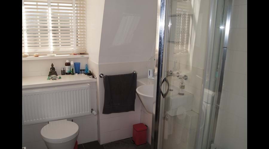 En-suite shower room also houses washing machine