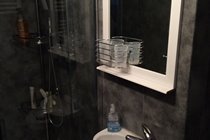 Bathroom adjacent to twin bedroom
