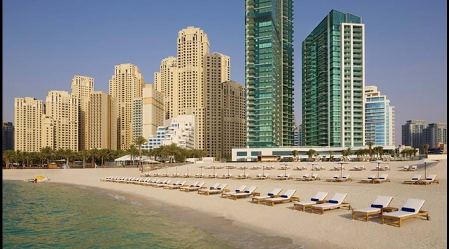 "Jumeirah Beach Al Bateen tower to the left Hilton Doubletree Hotel on the right"
