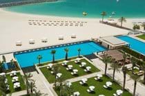 Welcome to Dubai - View of Al Bateen pool area and beach to the right Hilton Hotel pool area on left