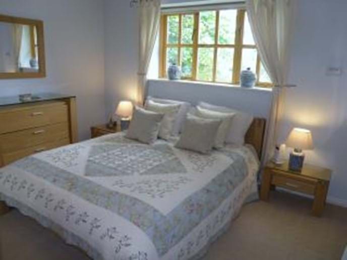 Master bedroom, with king size bed and en suite bathroom