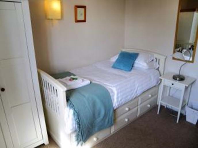 The fourth bedroom - with optional second full size single bed for groups of eight guests