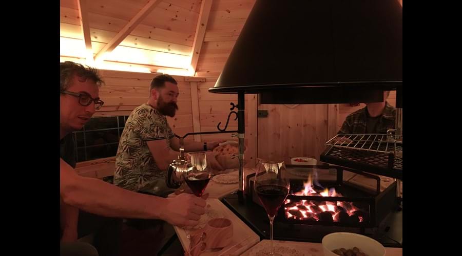 Guests enjoying the Scandinavian barbecue cabin