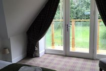 The master bedroom looking toward the balcony