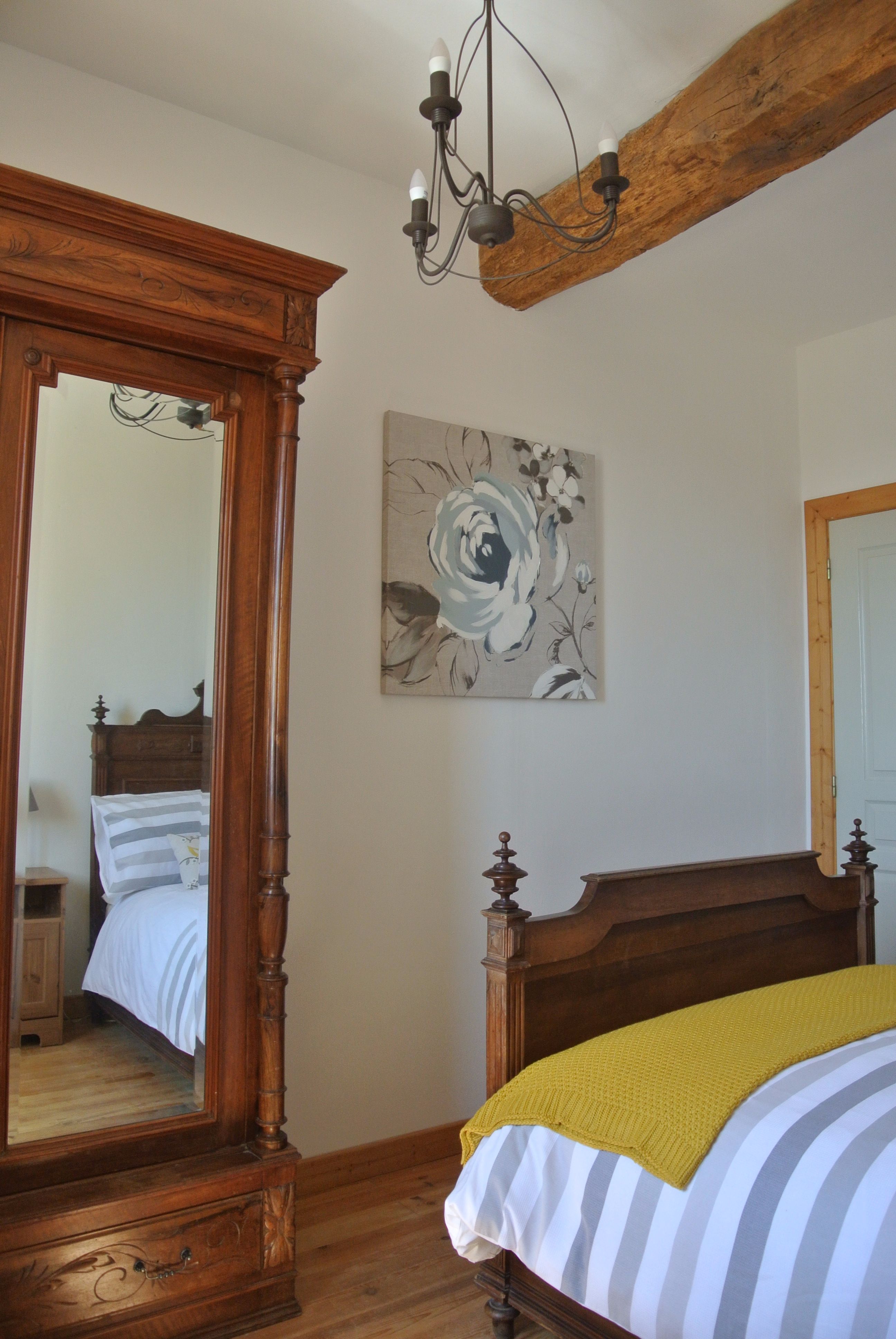 Antique French bed and wardrobe in master bedroom