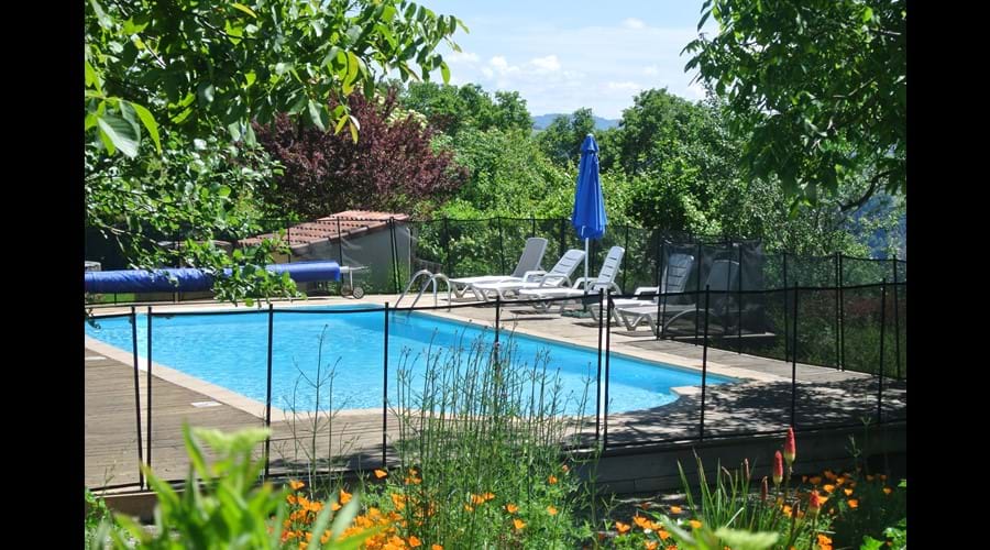 Heated pool and gardens at La Caze Gites