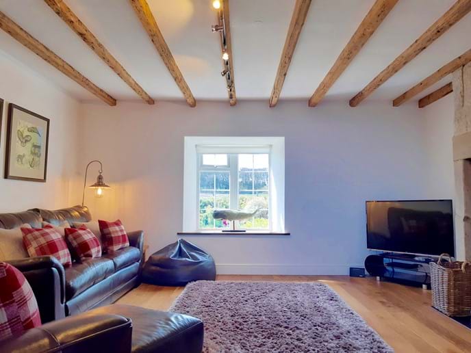 The original wooden beams add to the cottage