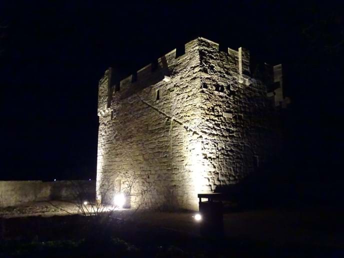 The Pele Tower opposite is illuminated at night, which is very atmospheric
