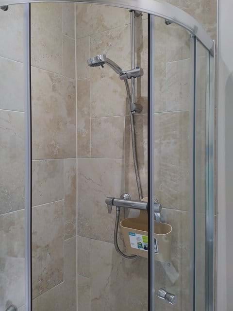Second en-suite with shower with riser rail and easy grip levers.