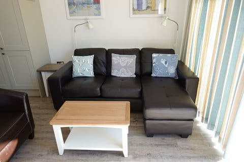The new corner sofa, tub chair and coffee table.