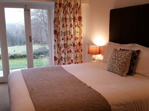 Have a duvet day whilst watching the wildlife - En suite Bedroom with french doors to the garden