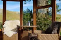 The summerhouse is perfect for dining whilst enjoying the views