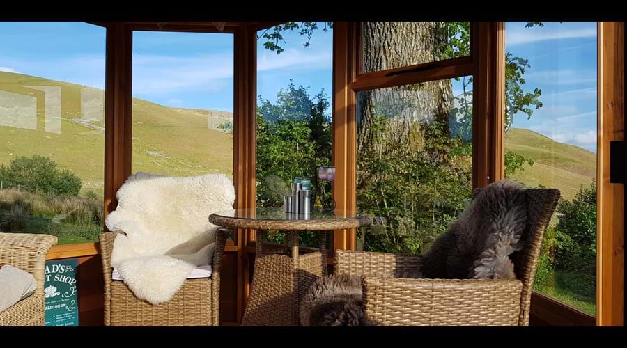 The summerhouse is perfect for dining whilst enjoying the views
