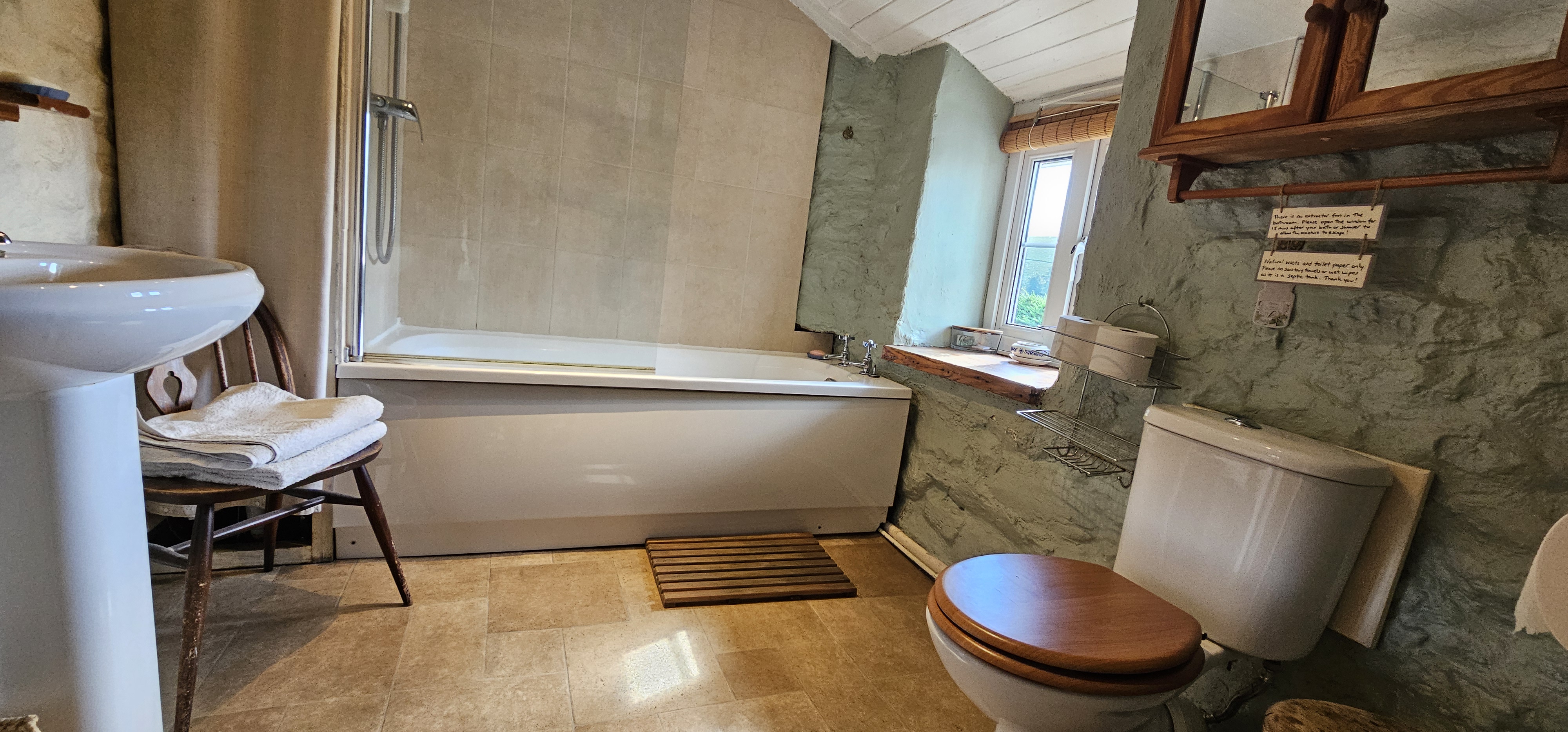 Relax in the bath with stunning views over the hills