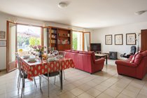 Dining and lounge area with patio doors