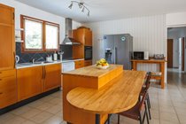 Kitchen with American fridge freezer and breakfast bar