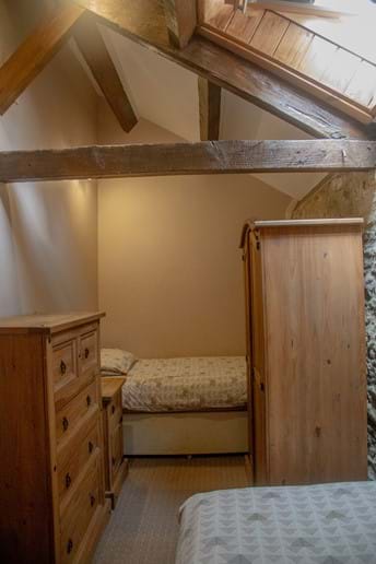 Laverock Lodge twin bedroom with beams