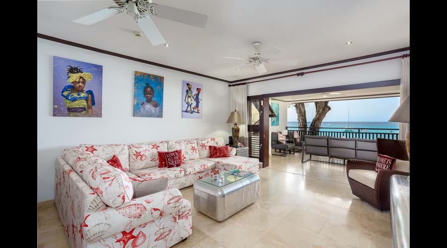 Internal loung area with L shaped sofa - Lovely wall art and great views on to our terrace