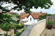 West facing terrace with village and sea views - The river Mun runs below the high bank