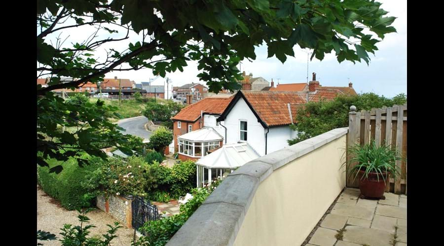 West facing terrace with village and sea views - The river Mun runs below the high bank