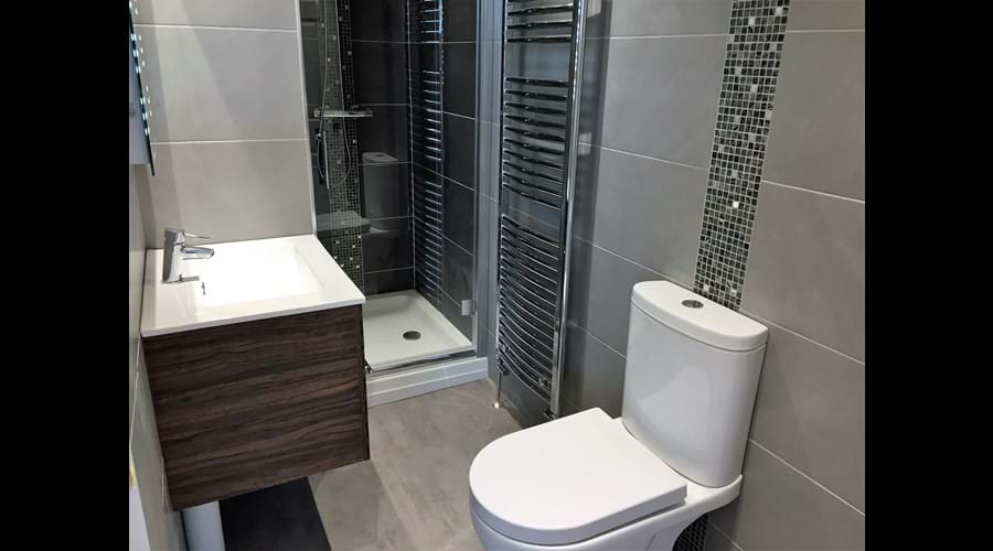 Ensuite to master bedroom with vanity unit & washbasin, led mirror and shaving point, shower cubicle and wc