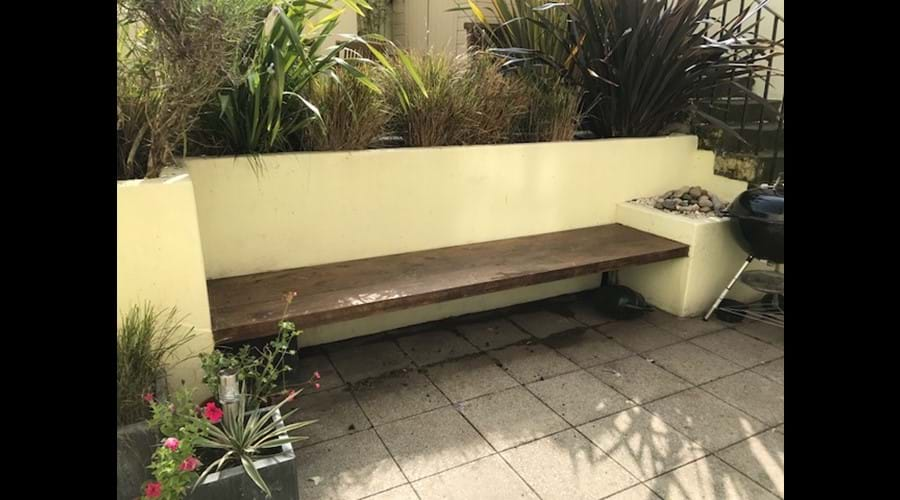 Lower Section of Patio Garden with Bench Seating and Barbecue