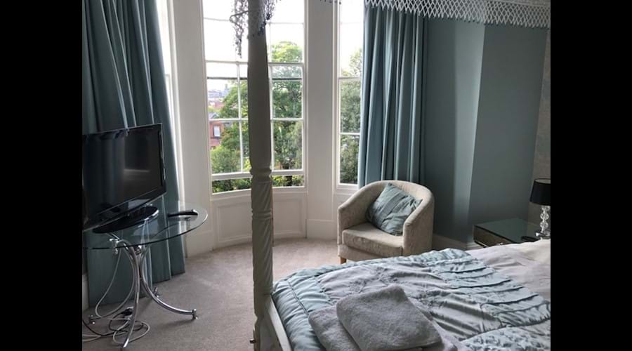 Master Bedroom with Bay Window and Flat Screen TV