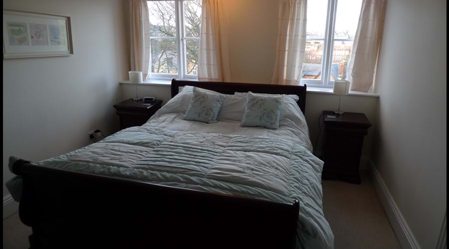Bedroom 2: Kingsize sleigh bed with wardrobe, chest of drawers, mirror and side tables