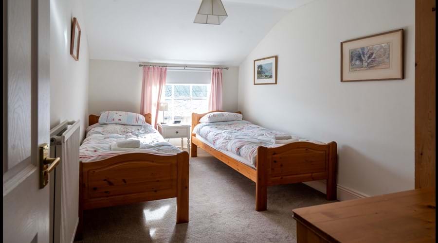 2nd Floor Twin Room with chest of drawers and wardrobe