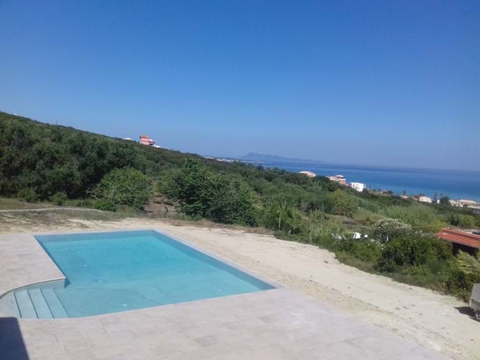 View of pool and Agios Stefanos bay 