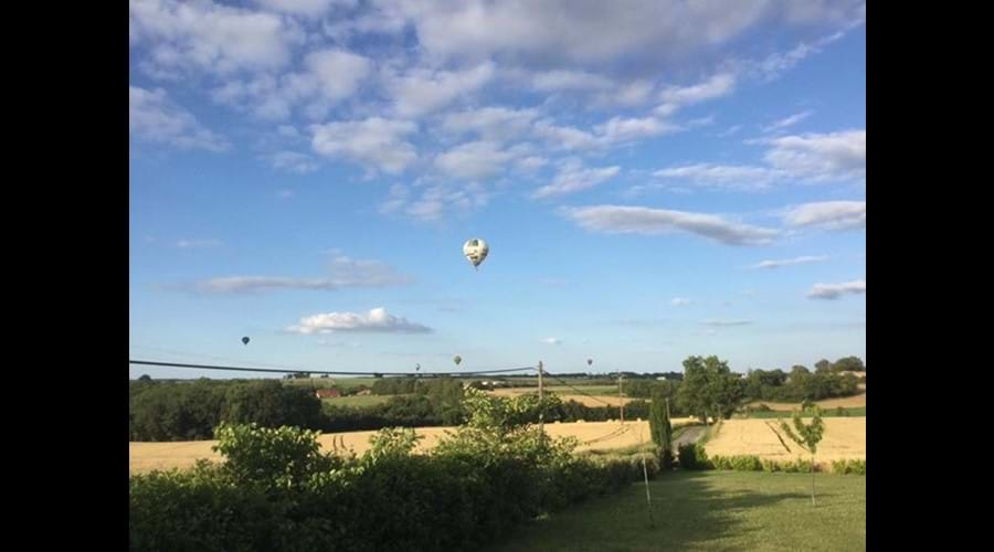 Balloons over neighbouring fields