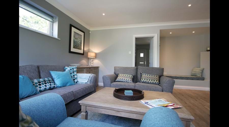 Living Room. Seating for 6 plus alcove seating. Artworks throughout the house are available for sale.