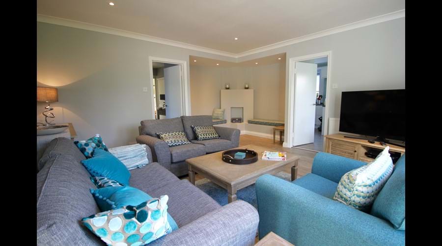 Living Room. 50" Ultra HD TV, SkyQ with Boxsets, DVD player.